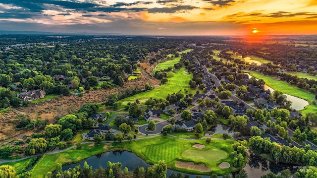 aerial view at dusk with a water view