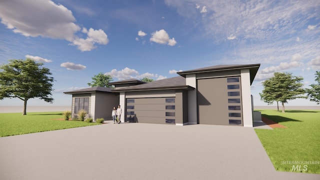 prairie-style home with a garage, concrete driveway, a front lawn, and stucco siding