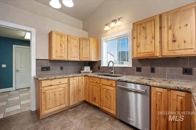 891 N Pointe Dr, Twin Falls, ID 83301 - kitchen featuring stainless steel dishwasher, a sink, light brown cabinetry, decorative backsplash, and lofted ceiling