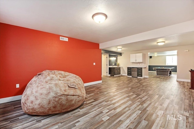 891 N Pointe Dr, Twin Falls, ID 83301 - living area with bar area, wood finished floors, baseboards, and wine cooler