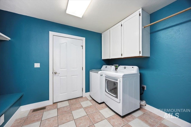 891 N Pointe Dr, Twin Falls, ID 83301 - washroom with cabinet space, washer and clothes dryer, and baseboards