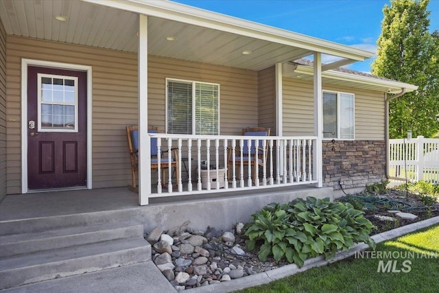 891 N Pointe Dr, Twin Falls, ID 83301 - doorway to property featuring covered porch and stone siding
