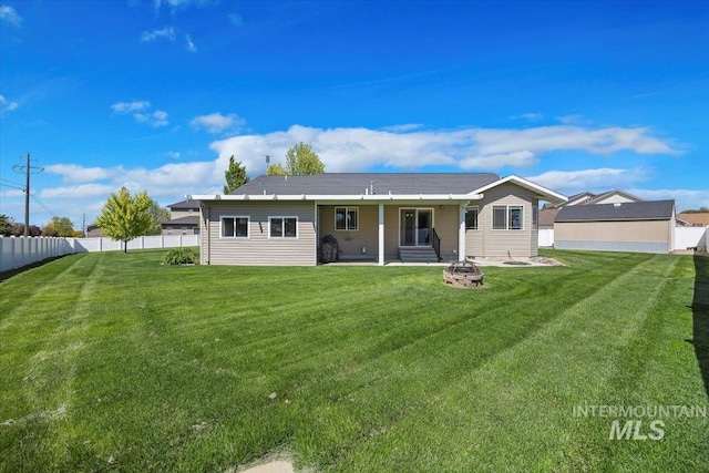 891 N Pointe Dr, Twin Falls, ID 83301 - back of property with an outdoor fire pit and a patio area