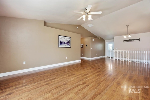 891 N Pointe Dr, Twin Falls, ID 83301 - unfurnished room featuring vaulted ceiling, light wood-style floors, baseboards, and ceiling fan
