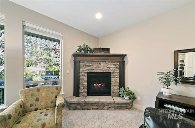 448 E Eaglewoods Ln, Eagle, ID 83616 - carpeted living room featuring a stone fireplace, baseboards, and lofted ceiling