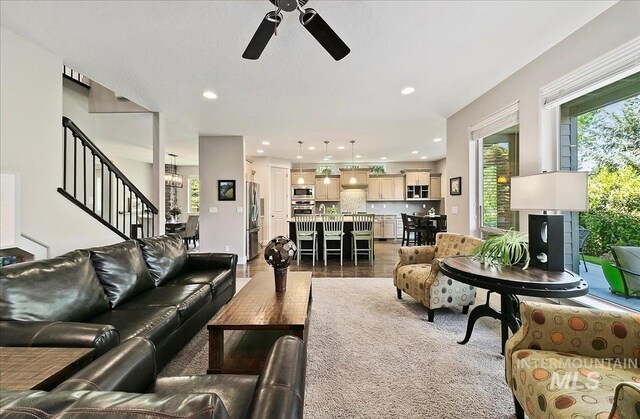 448 E Eaglewoods Ln, Eagle, ID 83616 - living room with healthy amount of natural light, ceiling fan, stairs, and recessed lighting