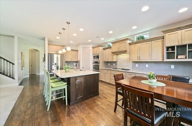 448 E Eaglewoods Ln, Eagle, ID 83616 - kitchen with appliances with stainless steel finishes, a sink, dark wood-style floors, light countertops, and recessed lighting