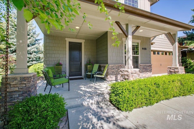 448 E Eaglewoods Ln, Eagle, ID 83616 - doorway to property featuring a porch and stone siding