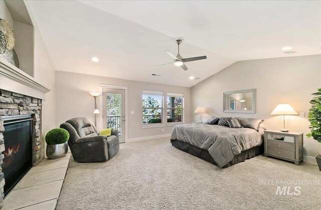 448 E Eaglewoods Ln, Eagle, ID 83616 - bedroom with lofted ceiling, access to exterior, light colored carpet, a fireplace, and a ceiling fan
