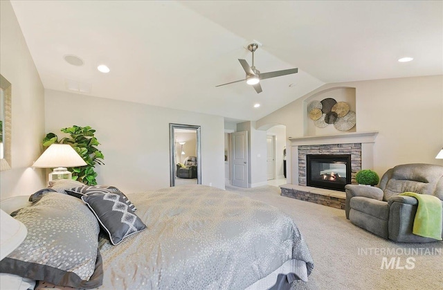 448 E Eaglewoods Ln, Eagle, ID 83616 - bedroom with carpet flooring, vaulted ceiling, a stone fireplace, a ceiling fan, and recessed lighting