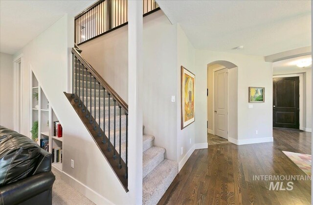 448 E Eaglewoods Ln, Eagle, ID 83616 - stairs featuring arched walkways, wood finished floors, and baseboards