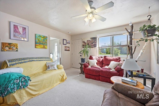 129 S Chestnut St, Kimberly, ID 83341 - carpeted living room featuring a ceiling fan and a textured ceiling