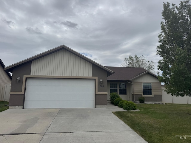 608 Heidi Ave, Twin Falls, ID 83301 - ranch-style house with concrete driveway, an attached garage, and a front lawn