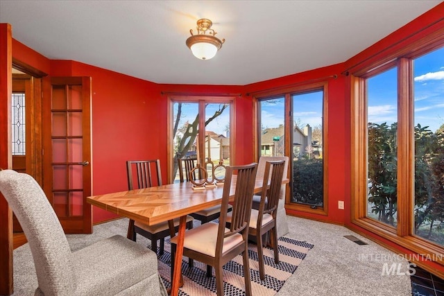 dining area featuring carpet flooring