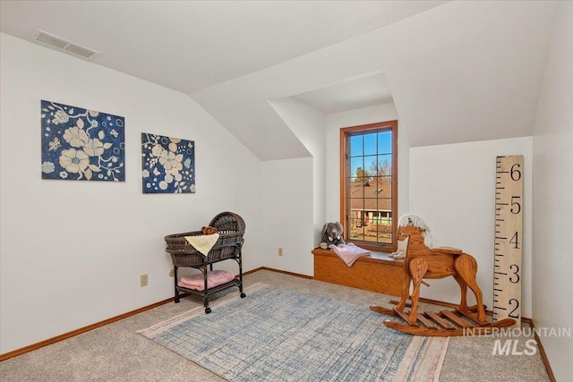 living area with carpet flooring and lofted ceiling