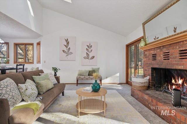 living room with carpet, a fireplace, and lofted ceiling