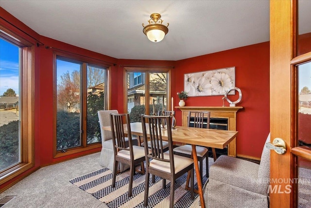 view of carpeted dining area