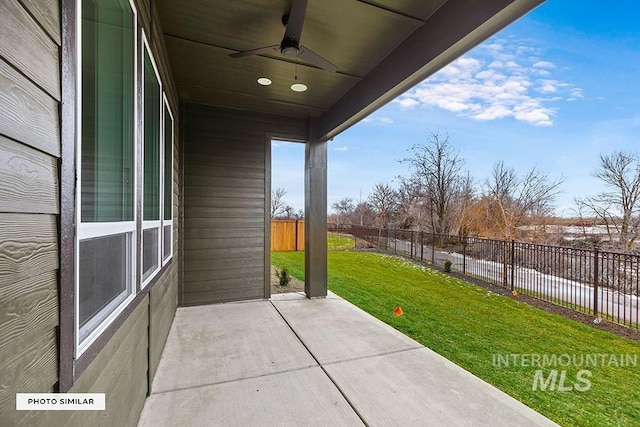 view of patio featuring a fenced backyard and a ceiling fan