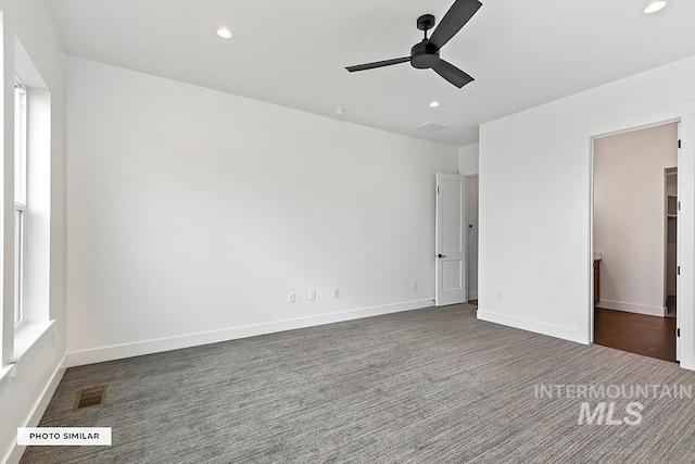 unfurnished bedroom featuring recessed lighting, carpet flooring, visible vents, and baseboards