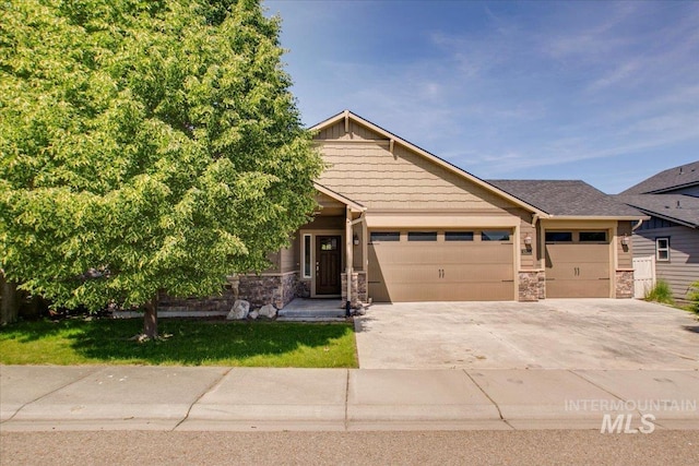 3225 N Quarrystone Way, Meridian, ID 83646 - view of front of property featuring stone siding, a garage, and concrete driveway