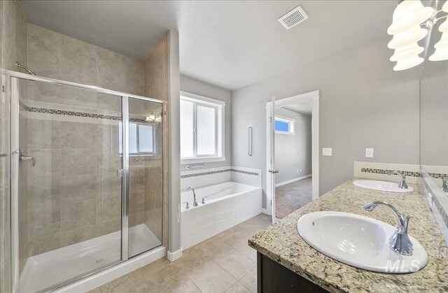 3225 N Quarrystone Way, Meridian, ID 83646 - full bath featuring a garden tub, a shower stall, double vanity, and tile patterned floors