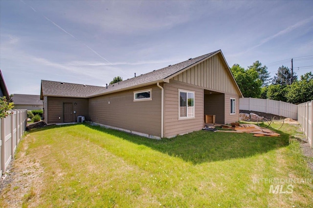 3225 N Quarrystone Way, Meridian, ID 83646 - rear view of property featuring board and batten siding, central AC, and a shingled roof