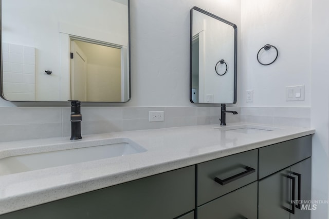 bathroom with double vanity and a sink