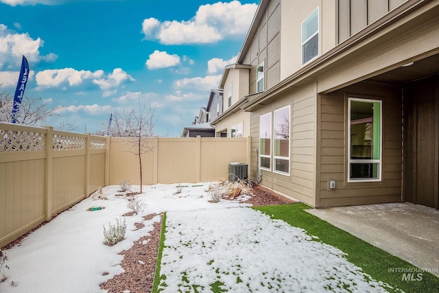 view of yard with cooling unit and a fenced backyard