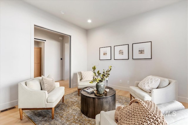 sitting room with light hardwood / wood-style floors