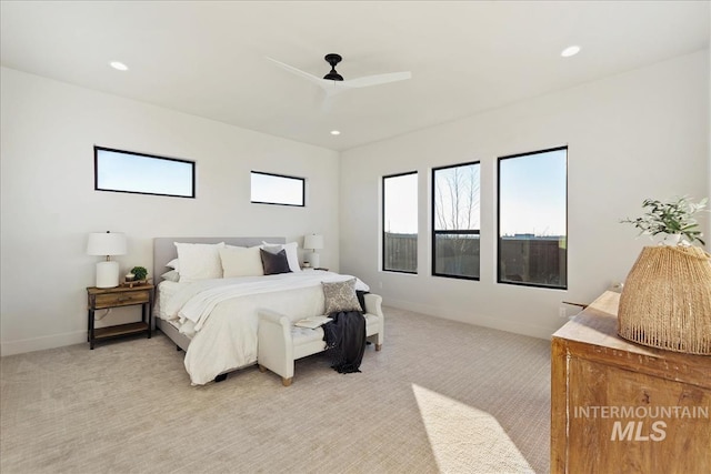 bedroom featuring ceiling fan and light colored carpet