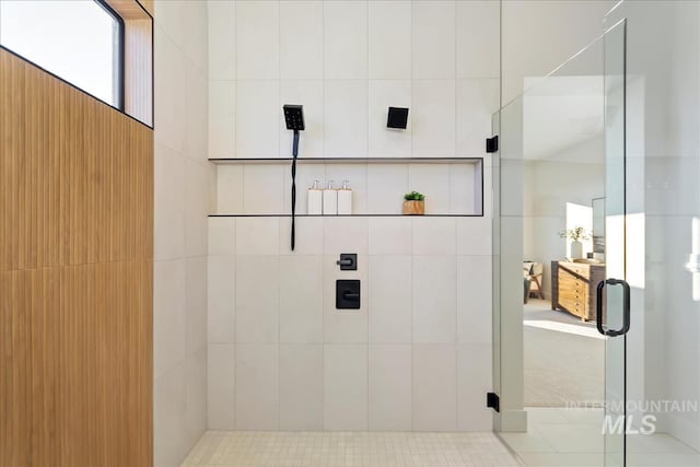 bathroom with a shower with shower door