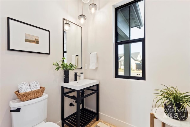 bathroom with toilet and sink