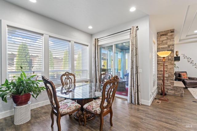 2133 N Star Garnet Ave, Kuna, ID 83634 - dining space with dark wood finished floors, baseboards, and recessed lighting