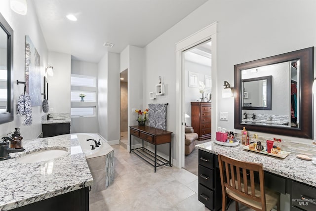 2133 N Star Garnet Ave, Kuna, ID 83634 - full bathroom with a garden tub, two vanities, and tile patterned flooring