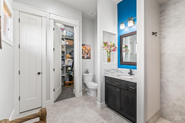 2133 N Star Garnet Ave, Kuna, ID 83634 - full bathroom featuring toilet, vanity, and a spacious closet