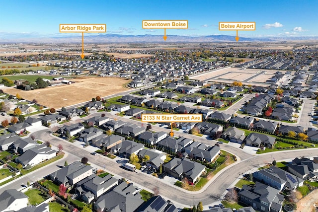 2133 N Star Garnet Ave, Kuna, ID 83634 - aerial view of property and surrounding area with nearby suburban area and a mountain backdrop