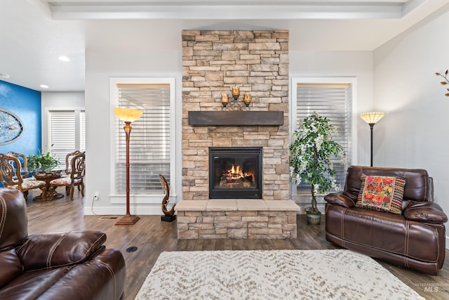 2133 N Star Garnet Ave, Kuna, ID 83634 - living area featuring a stone fireplace and wood finished floors