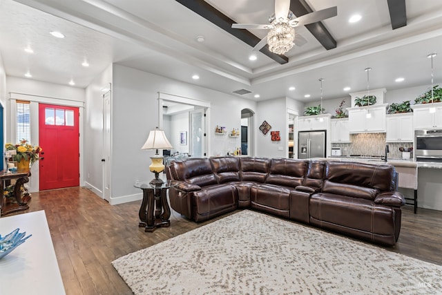 2133 N Star Garnet Ave, Kuna, ID 83634 - living area featuring a ceiling fan, dark wood finished floors, recessed lighting, arched walkways, and baseboards