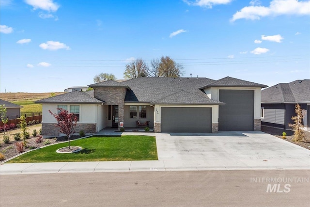 1279 W Ultar, Nampa, ID 83686 - single story home featuring an attached garage, a front lawn, stone siding, stucco siding, and driveway