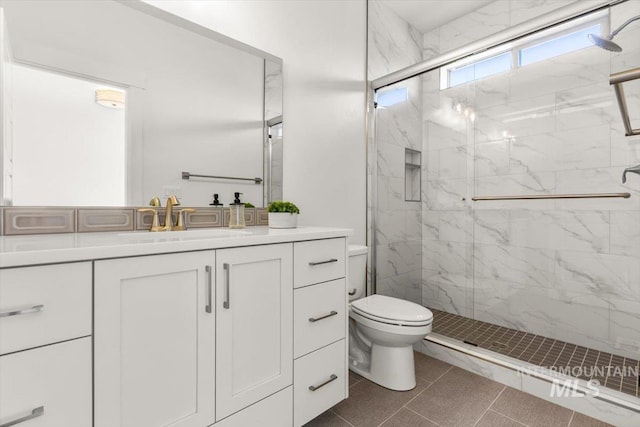 1279 W Ultar, Nampa, ID 83686 - full bathroom featuring a marble finish shower, vanity, and toilet