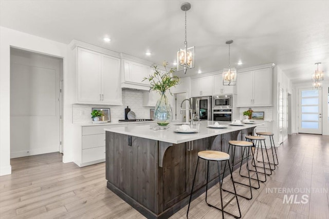 1279 W Ultar, Nampa, ID 83686 - kitchen featuring light countertops, stainless steel appliances, a notable chandelier, and recessed lighting