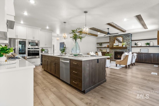 1279 W Ultar, Nampa, ID 83686 - kitchen featuring a sink, light countertops, dark brown cabinetry, and stainless steel appliances