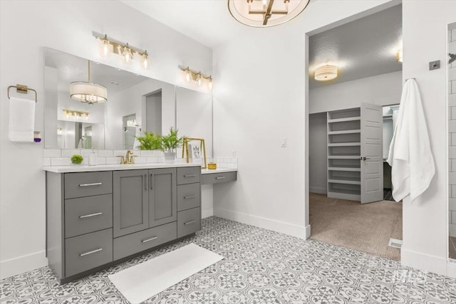 1279 W Ultar, Nampa, ID 83686 - full bathroom featuring baseboards, vanity, and an inviting chandelier