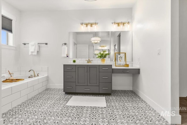 1279 W Ultar, Nampa, ID 83686 - bathroom with baseboards, tile patterned flooring, a garden tub, and vanity