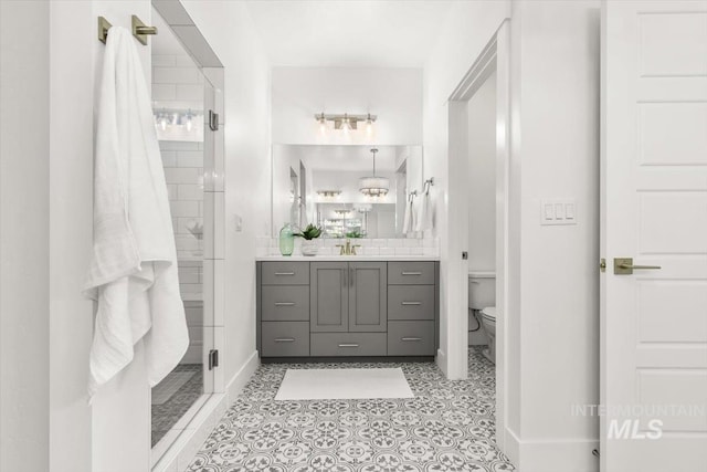 1279 W Ultar, Nampa, ID 83686 - full bath with vanity, baseboards, a shower stall, and toilet