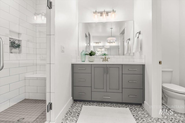 1279 W Ultar, Nampa, ID 83686 - full bathroom featuring vanity, toilet, baseboards, and a stall shower