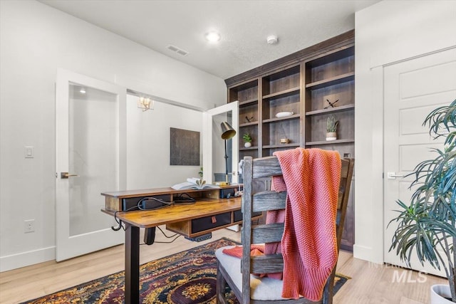 1279 W Ultar, Nampa, ID 83686 - home office with light wood-style floors, baseboards, and visible vents
