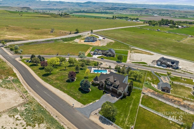 birds eye view of property featuring a rural view