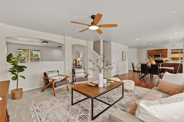 11422 W Darkwood St, Star, ID 83669 - living room featuring arched walkways, a ceiling fan, stairway, recessed lighting, and baseboards