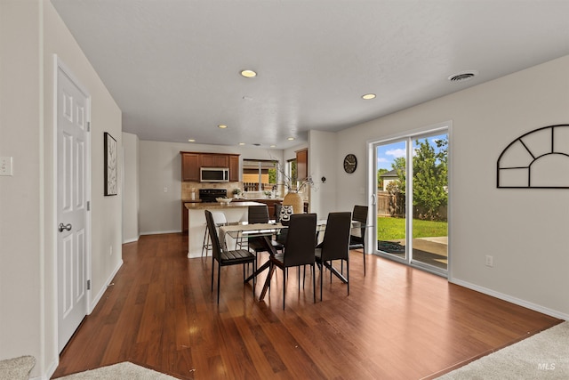 11422 W Darkwood St, Star, ID 83669 - dining room with recessed lighting, dark wood-style floors, and baseboards